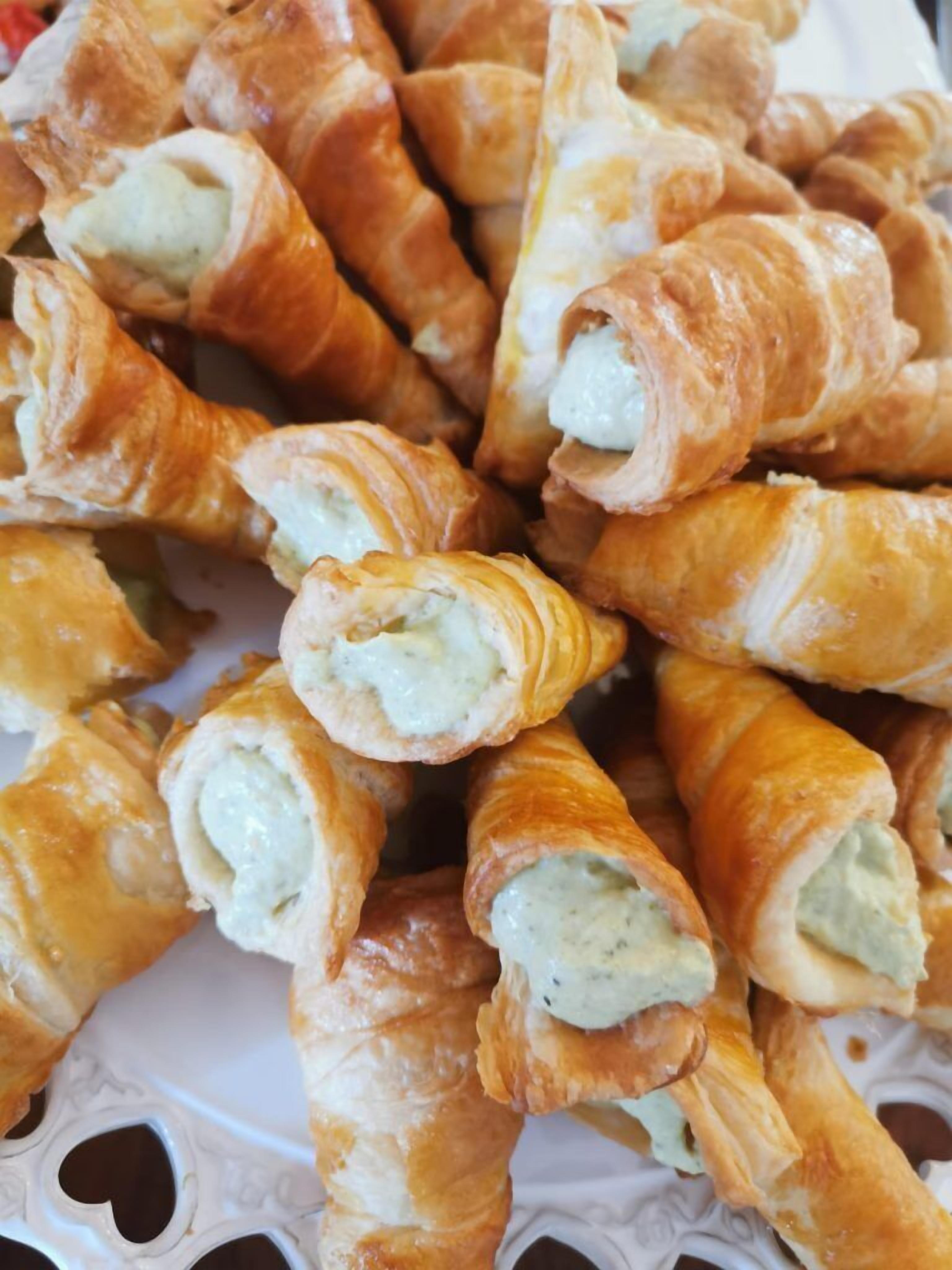 A plate of croissants with a creamy filling.