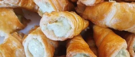 A plate of croissants with a creamy filling.