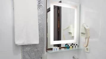 Shower, hair dryer, slippers, towels