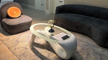 Deluxe Apartment, Balcony, City View | Living area | Flat-screen TV, video-game console