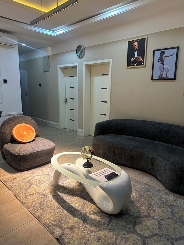 Deluxe Apartment, Balcony, City View | Living area | Flat-screen TV, video game console - majestic villa residence (Abuja)