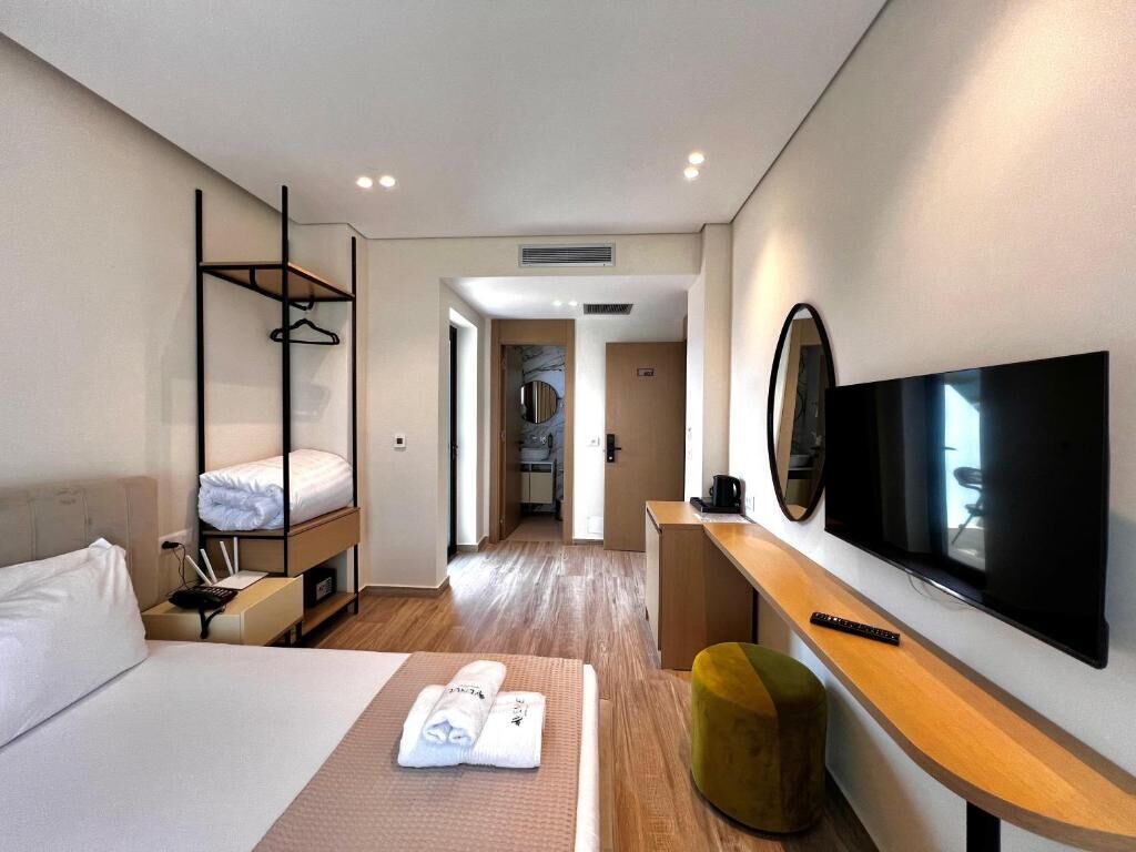 Chambre Deluxe, vue partielle sur l'océan