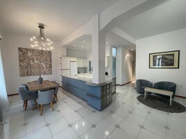 Family Apartment, Balcony | Living area | Flat-screen TV