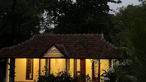 A traditional house with a tiled roof and a central decorative element. - Beach Front Home in Marari : Marari Helen Villa (Mararikulam)