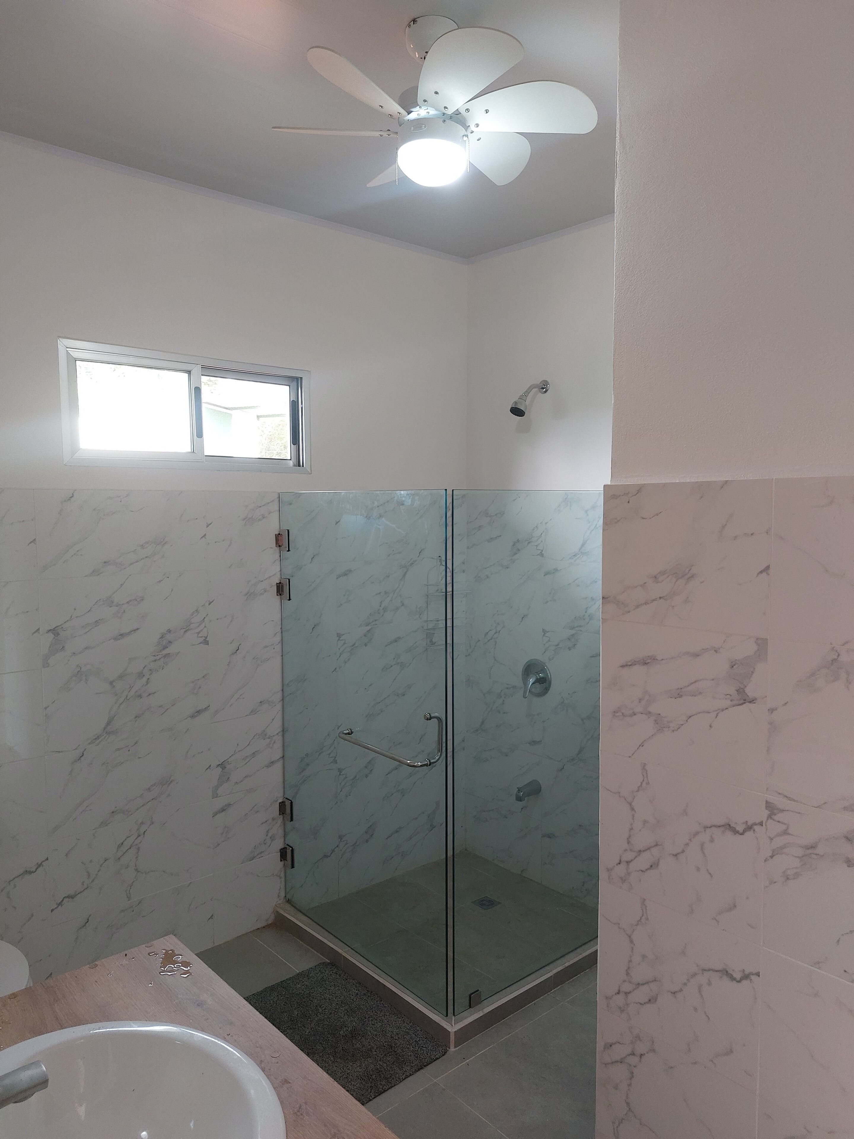 Shower, towels, soap, toilet paper