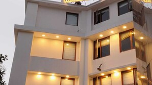 A multi-story building with a sign reading 'HOTEL SHIVANI' at the top. - Shivani Foods And Resort (Ranikhet)