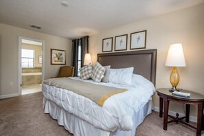 Comfortable accommodations feature a large bed, bedside tables, and lamps for a restful stay.