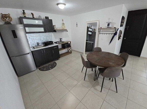 Fridge, microwave, stovetop, coffee/tea maker