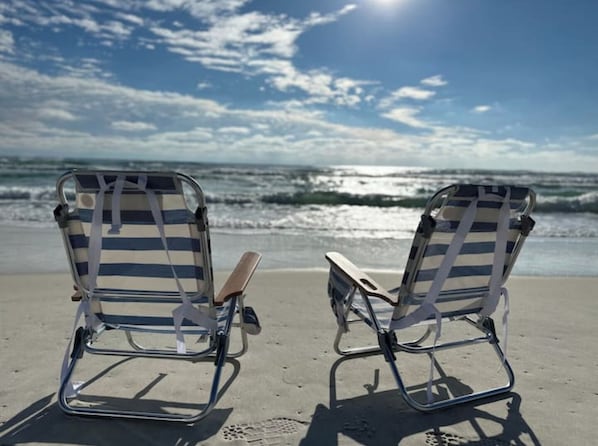 On the beach, sun loungers, beach towels