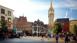 A bustling square with historic buildings, including a prominent clock tower. - City Centre Luxury ApartmentSofa BedWIFI (Leicester)