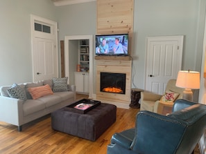 Smart TV, fireplace, books