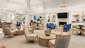 A spacious lobby with a fireplace, comfortable seating, and a large television screen. - Marriott’s Harbour Club 2-Bedroom Villas – The Perfect Lowcountry Getaway (Hilton Head Island)