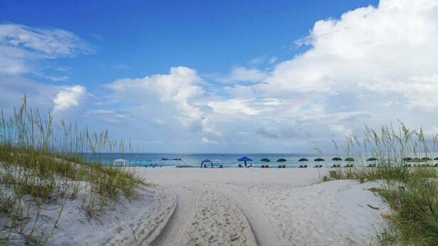 A beach path leading to beach umbrellas and lounge chairs. - 5 Min Stroll to Beach in PCB: Gm Rm+Put Grn+Yard! (Panama City Beach)