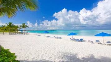 On the beach, sun-loungers, beach towels