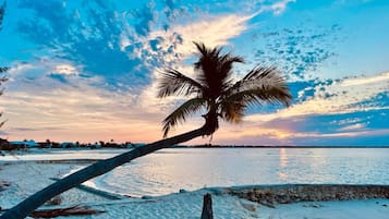 On the beach, sun loungers, beach towels