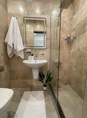 Standard Triple Room, 1 Bedroom, Kitchenette, City View | Bathroom | Slippers, towels, soap, shampoo - Danda Moon Pyramids Hotel (Giza)