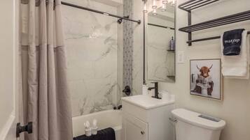 Shower, hair dryer, towels, shampoo