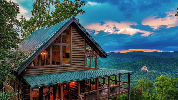A log cabin with a large porch and a scenic mountain view. - Serenity - Mountain VIEWS From Every Room! - 71 Windows (Sevierville)