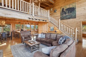 Smart TV, fireplace, books, computer monitors