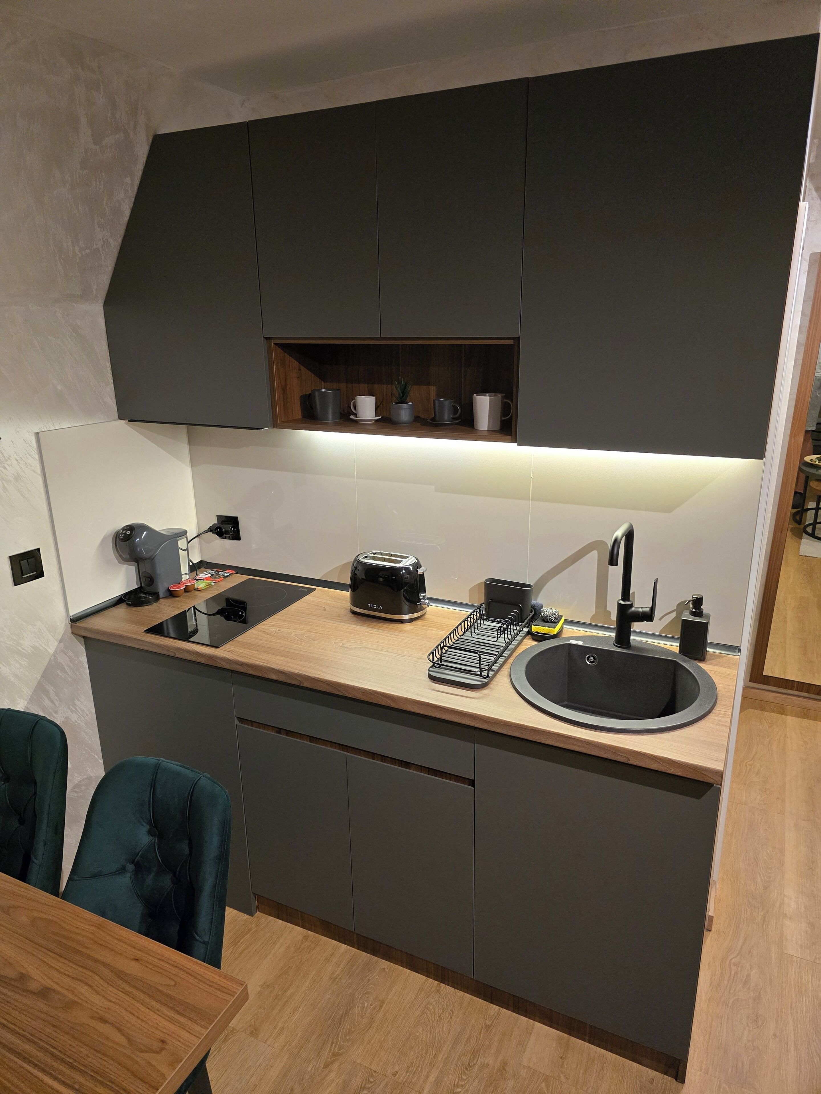 Fridge, coffee/tea maker, toaster, cookware/dishes/utensils