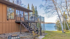 A house with a balcony and a view of a lake. - Beautiful home on Lake Pokegama! (Grand Rapids)