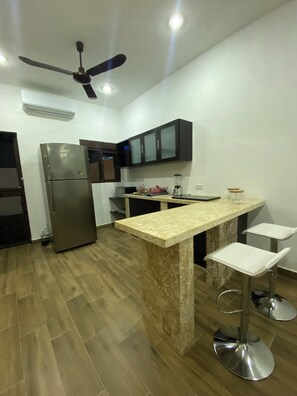 Fridge, microwave, stovetop, coffee/tea maker