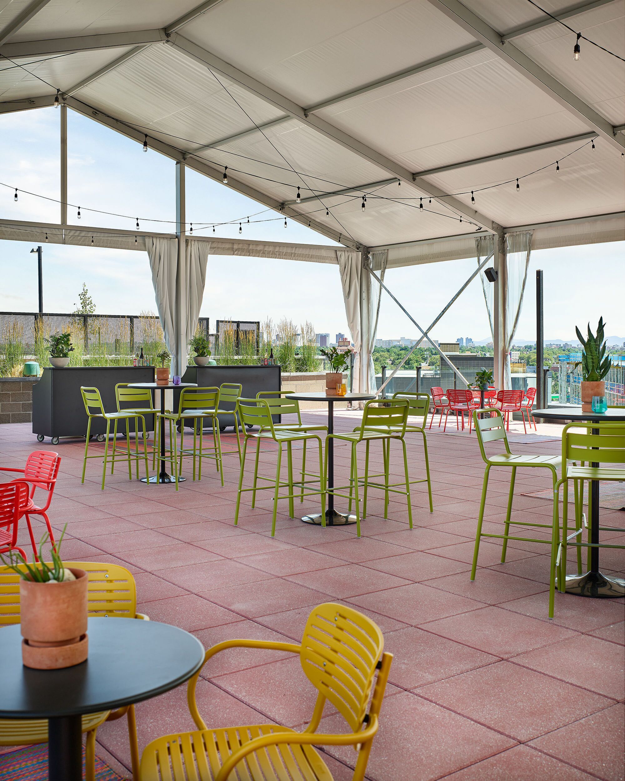 A well-designed rooftop space with modern seating and natural light, creating a fresh and dynamic atmosphere for collaboration and celebrations.
