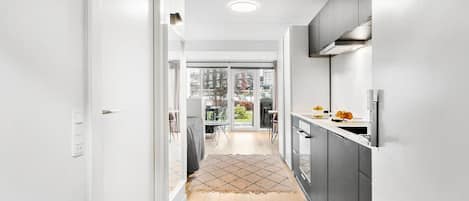 Fridge, stovetop, dishwasher, coffee/tea maker