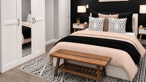 A bedroom with a bed, bedside tables, a nightstand, a bench, a wardrobe, and a painting on the wall. - Boutique Studio 10 min. walk to UBS Arena (Elmont)