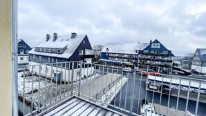 A view of a residential area with houses and a road. - Vacation apartment in the mountain resort 3.3.5 - Adventure & wellness with infrared cabin! (Winterberg)
