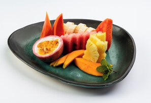 A plate of assorted fruits including watermelon, pineapple, and passion fruit. - Ferndale Retreat (Rangala)