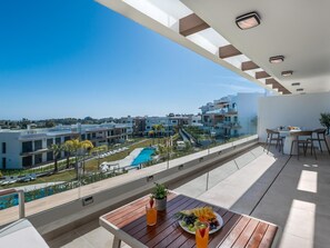 Outdoor dining - Newly Built 2 BDRM Modern Oasis w Gym & Pool (Estepona)