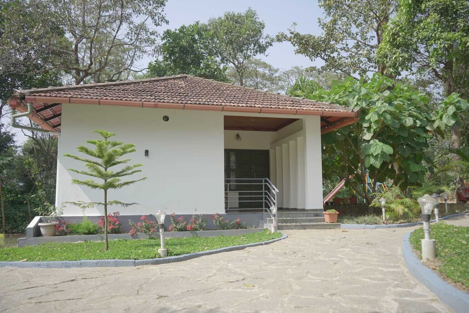 A small, single-story building with a tiled roof and a covered entrance.