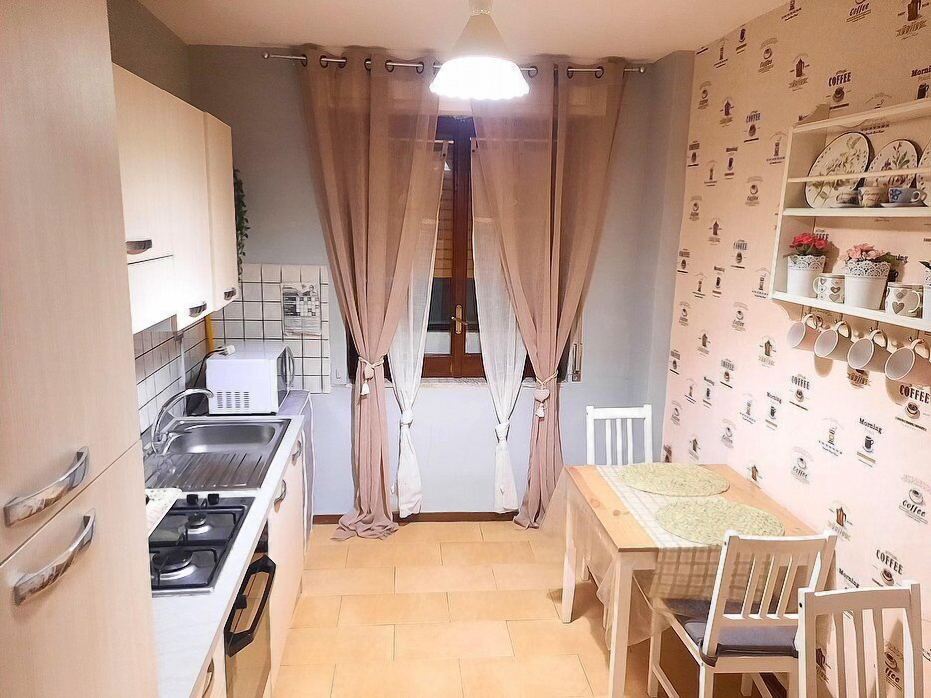 Stovetop, coffee/tea maker, cookware/dishes/utensils, dining tables