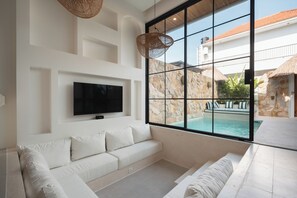 Deluxe Villa, 1 King Bed, Balcony, Pool View | Living area | 50-inch Smart TV with digital channels - Villa Kaia by Alfred in Bali (Canggu)