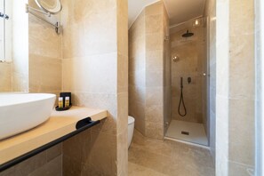 Shower, hair dryer, towels, toilet paper
