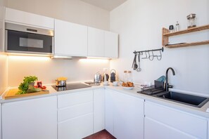 Standard Apartment, Multiple Bedrooms, Mountainside (Tesori Della Vetta Pom Rose) | Private kitchen | Microwave, coffee/tea maker, electric kettle, cookware/dishes/utensils - Tesori Della Vetta (Lugano)