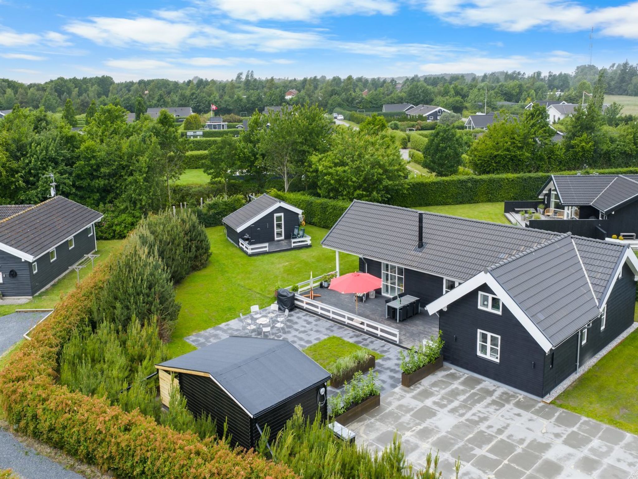 A residential area with multiple houses, each featuring a distinct architectural style.