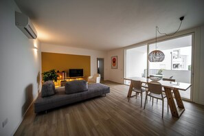 Apartment, 2 Bedrooms, Garden View | Living area | 43-inch flat-screen TV with digital channels, heated floors - CaNova (Spinea)