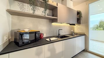 Apartment, 3 Bedrooms, Garden View | Private kitchen | Full-sized fridge, microwave, stovetop, espresso maker