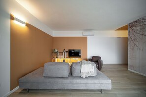 Apartment, Garden View | Living area | 43-inch flat-screen TV with digital channels, heated floors - CaNova (Spinea)