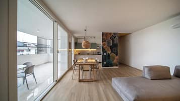 Apartment, 2 Bedrooms, Garden View | Living area | 43-inch flat-screen TV with digital channels, heated floors