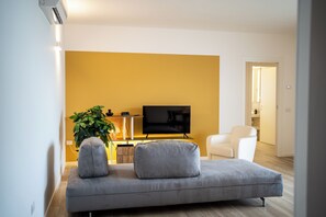 Apartment, 2 Bedrooms, Garden View | Living area | 43-inch flat-screen TV with digital channels, heated floors - CaNova (Spinea)