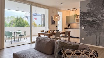 Apartment, 2 Bedrooms, Kitchenette, Garden View | Living area | 43-inch flat-screen TV with digital channels, heated floors