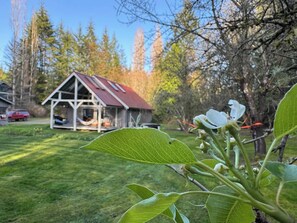 Escape to a serene natural haven surrounded by lush greenery and a tranquil atmosphere.