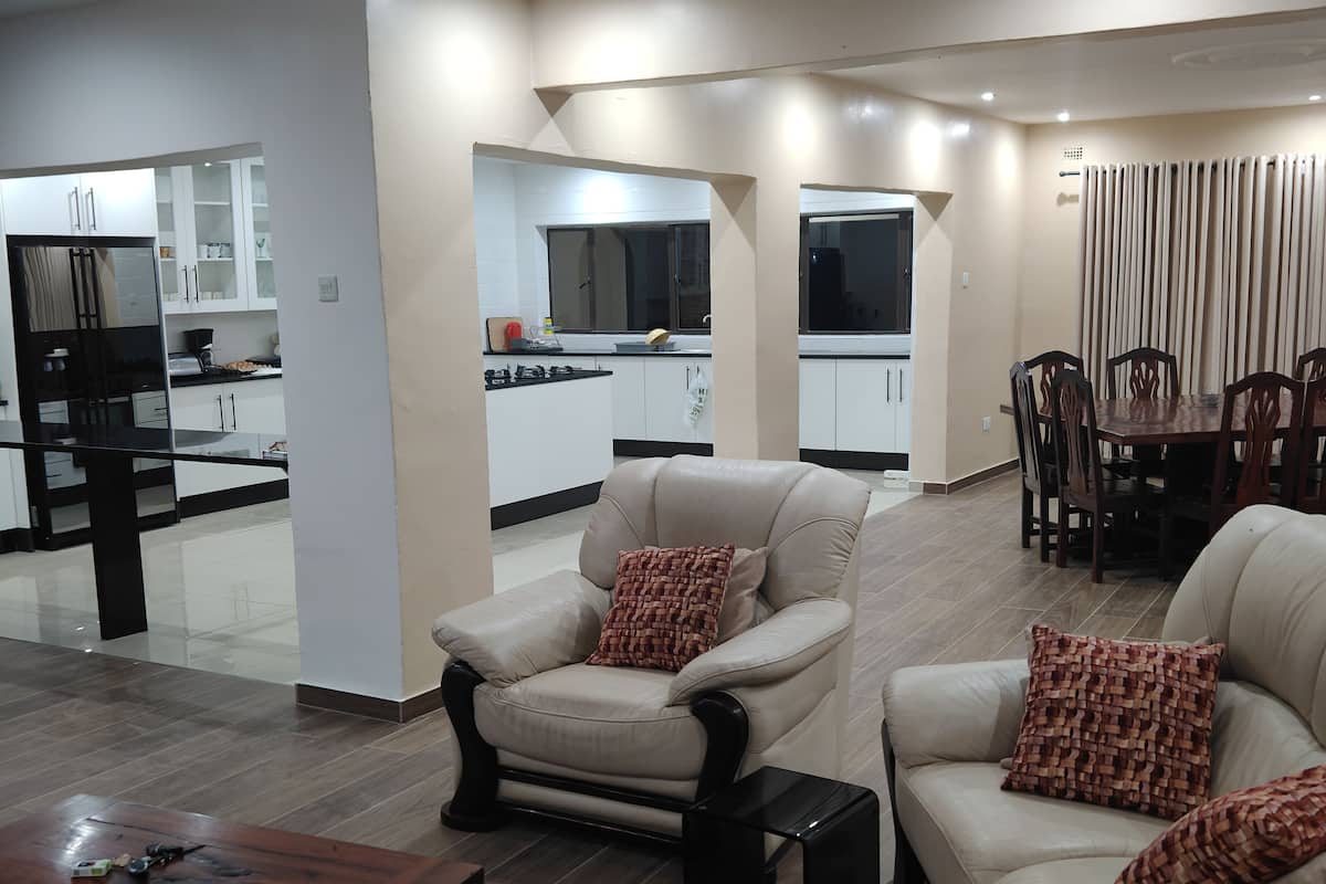 Deluxe Double Room, Patio, Garden View | Living area