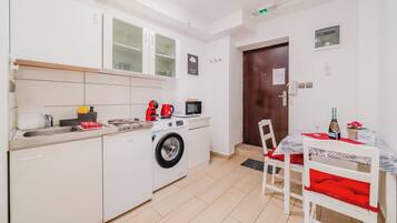 Fridge, microwave, stovetop, coffee/tea maker