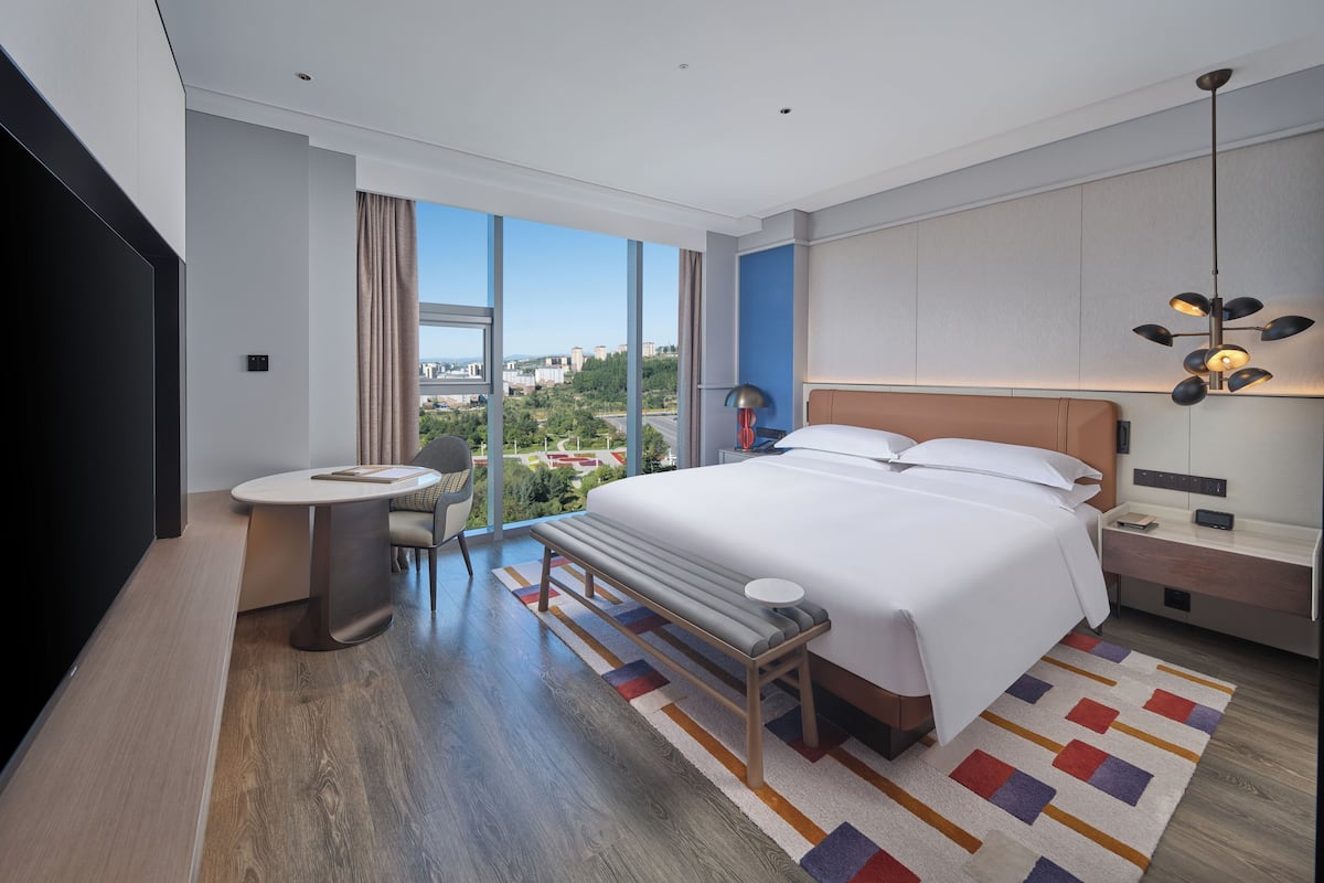 Deluxe Suite, 1 King Bed | Down comforters, minibar, in-room safe, individually decorated