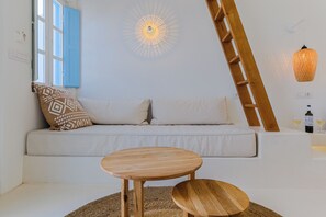 Superior Suite with Sea View and Outdoor Heated Jacuzzi | Living area | Flat-screen TV - SunSea Living Suites (Santorini)