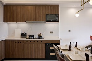 Fridge, microwave, oven, dining tables